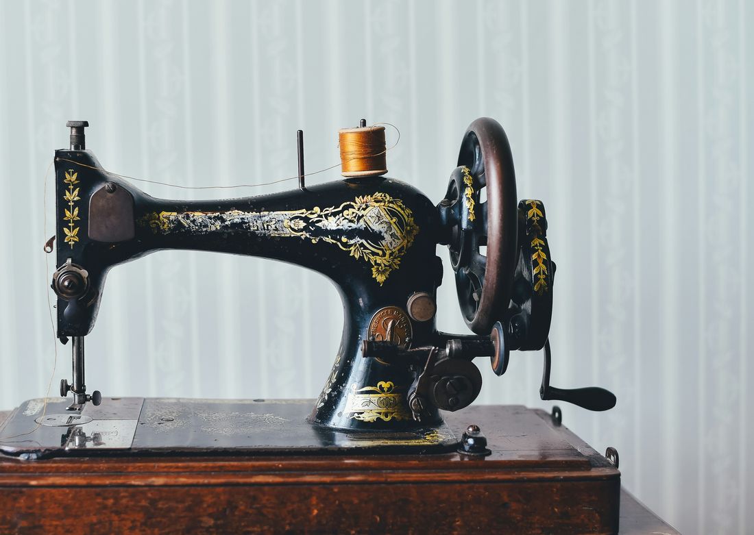 A vintage black and gold sewing machine